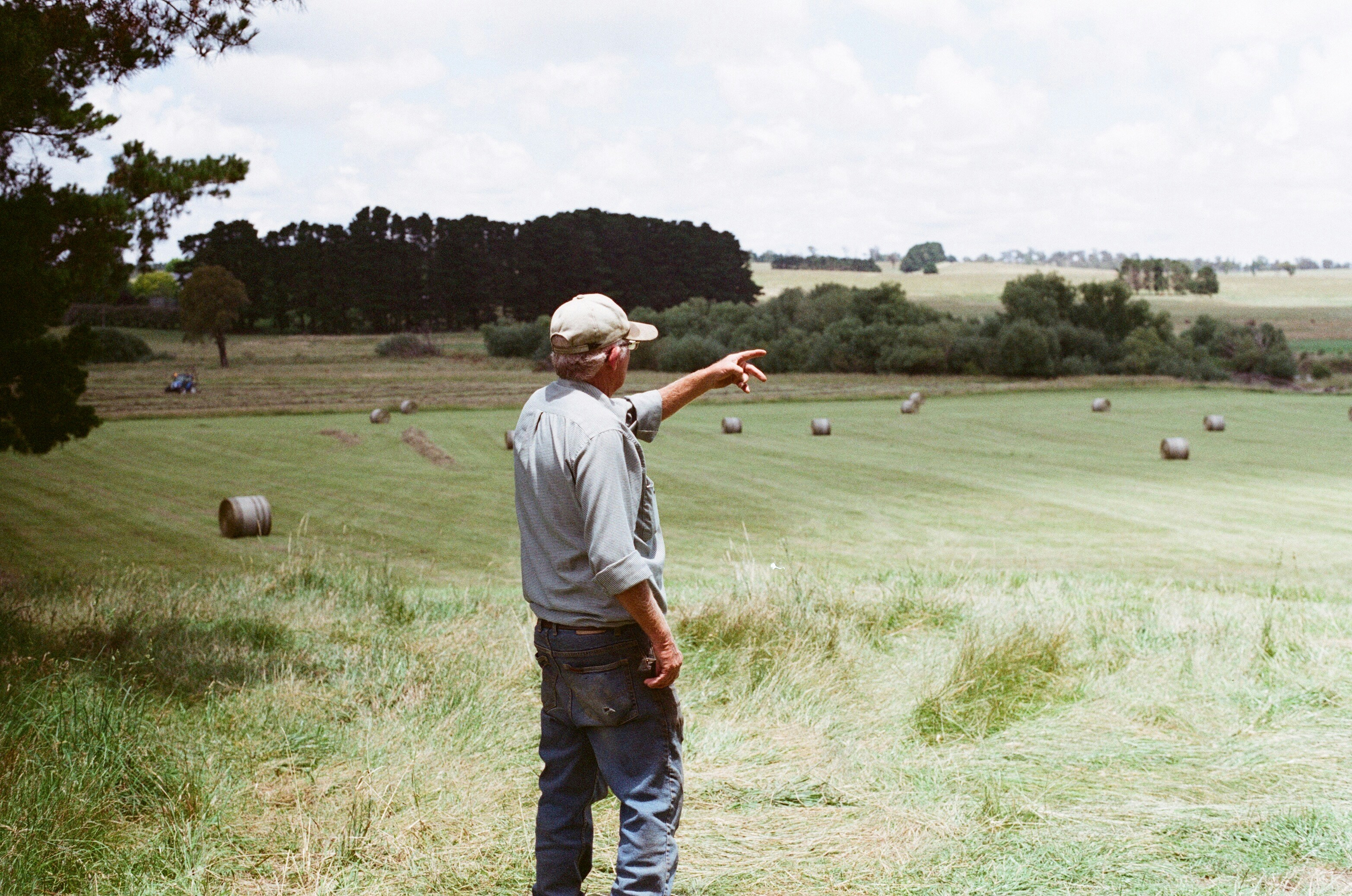 Landowner walking pasture land managed through BirdDog platform